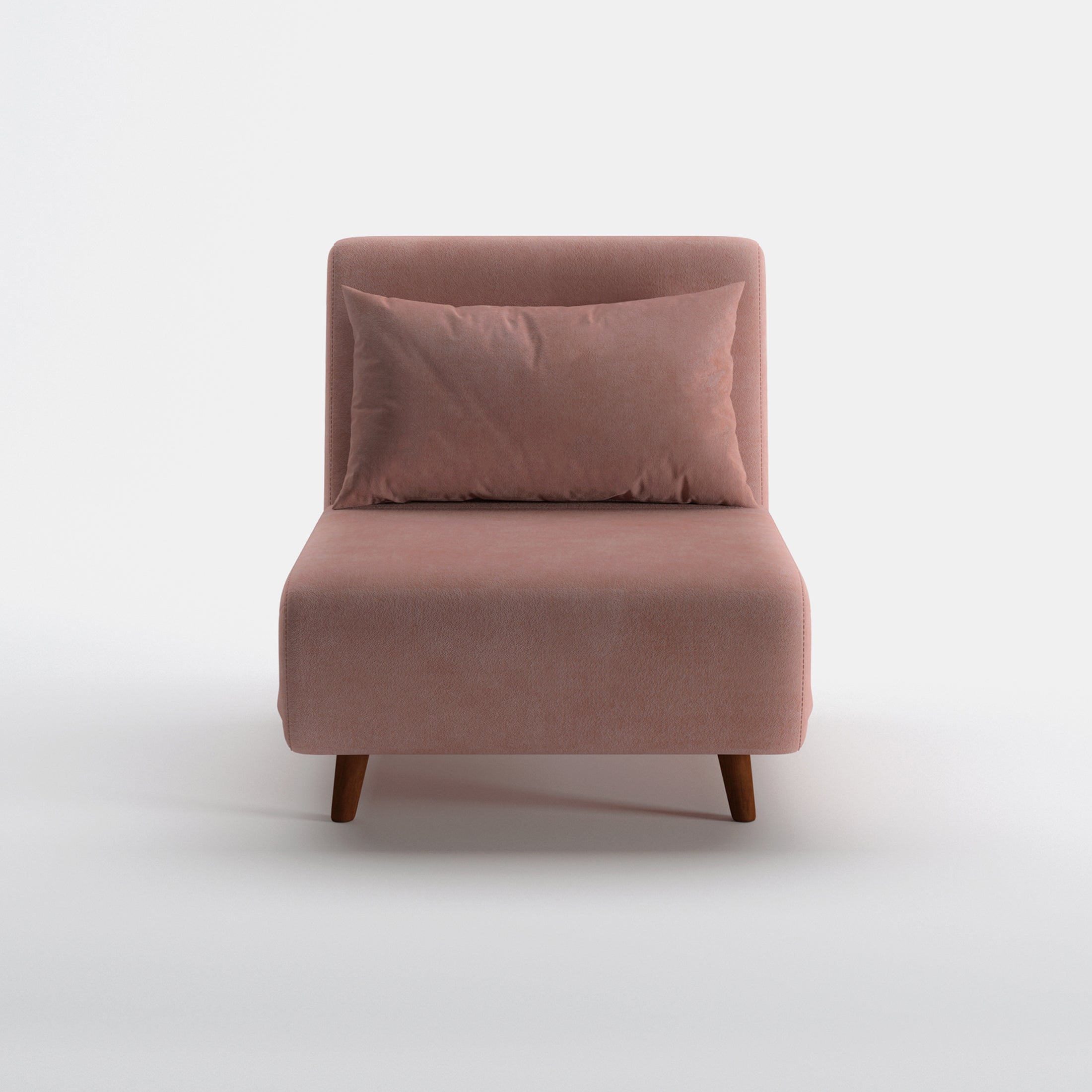 Tustin Convertible Chair in Velvet Blush shown from the front with a matching lumbar pillow, wide armless seat, upholstered backrest, and tapered dark brown wood legs.