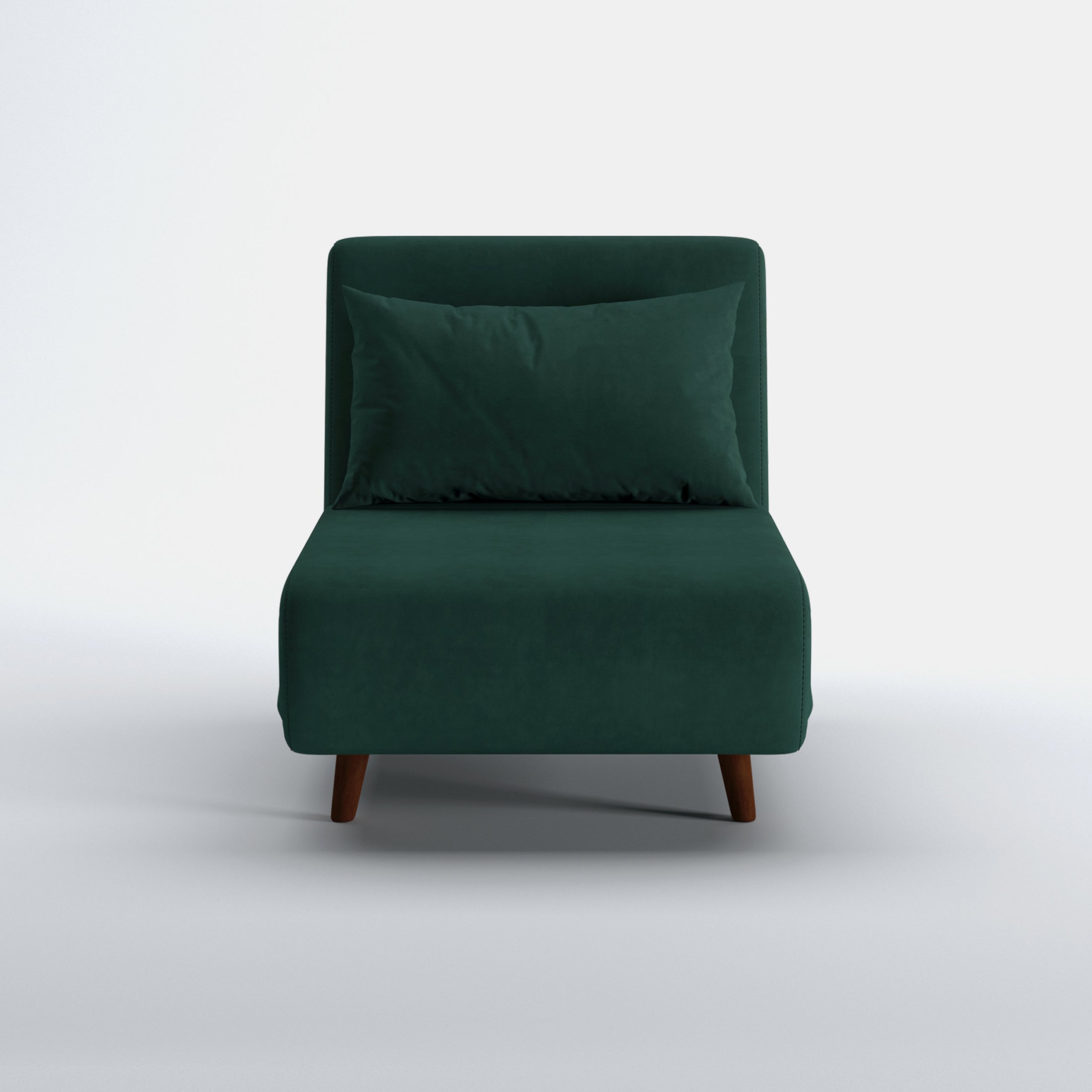 Tustin Convertible Chair in Velvet Green shown from the front with a matching lumbar pillow, wide armless seat, upholstered backrest, and tapered dark brown wood legs.