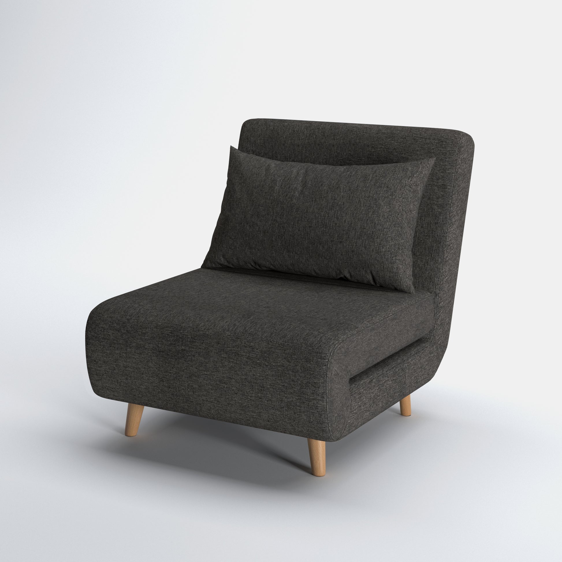 Tustin Convertible Chair in Charcoal shown from a front angle, highlighting its textured upholstery, rounded seat, matching pillow, and angled natural wood legs.