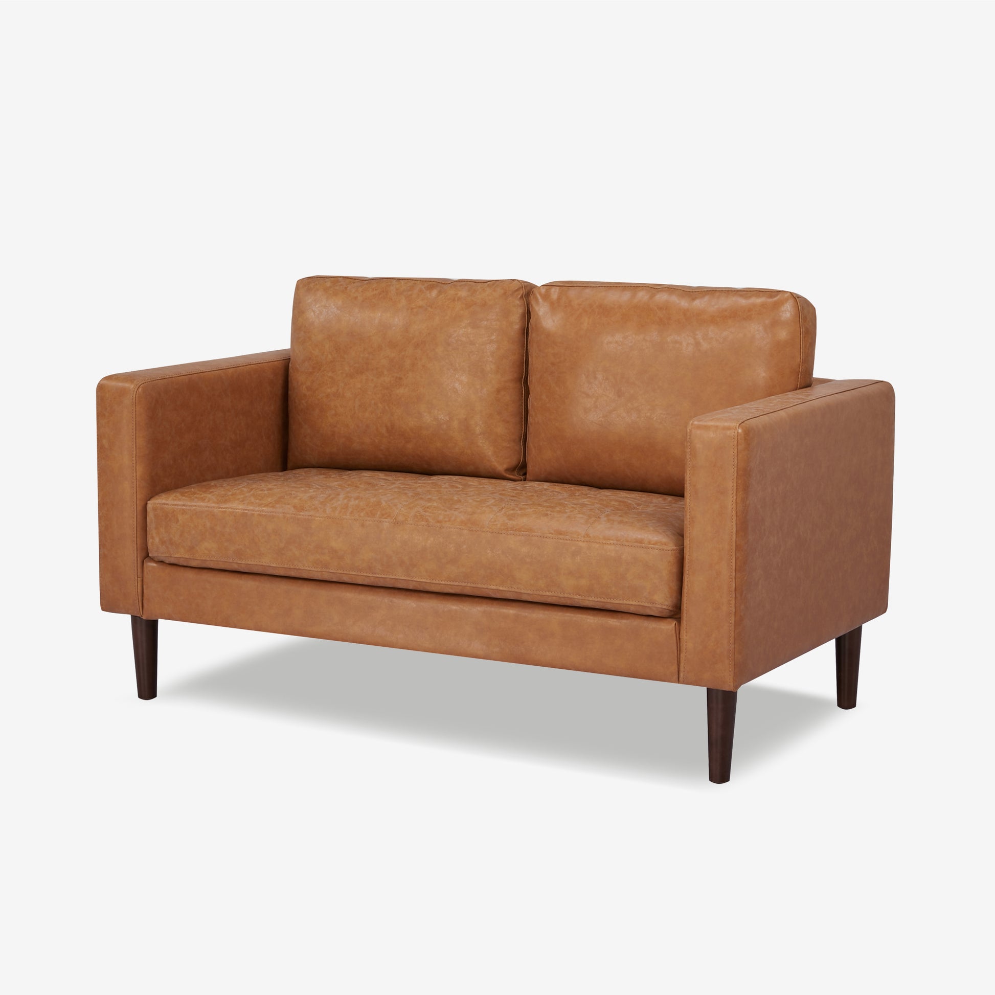 Orlando Loveseat in Faux Leather Camel shown from a front angle, highlighting its distressed faux leather finish, boxy arms, stitched cushions, and tapered legs.