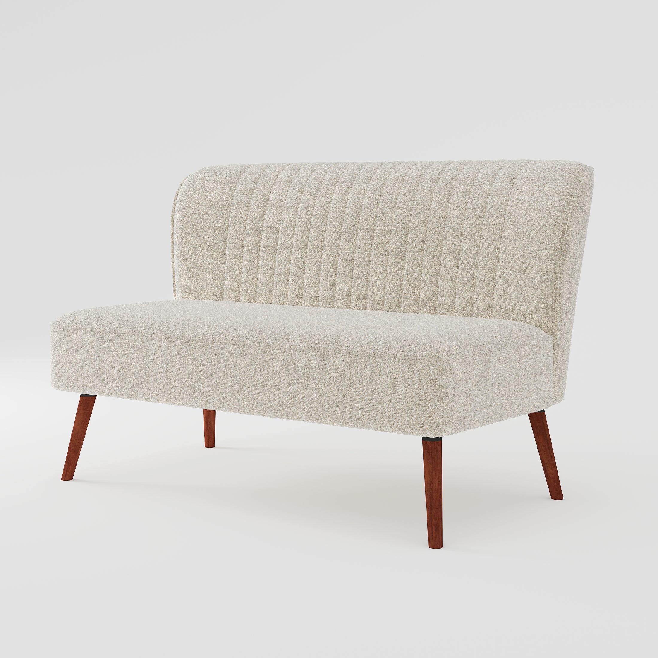 Hollywood Loveseat in Ivory shown from a front angled view, highlighting its armless silhouette, channel-tufted back, textured fabric, and angled wood legs