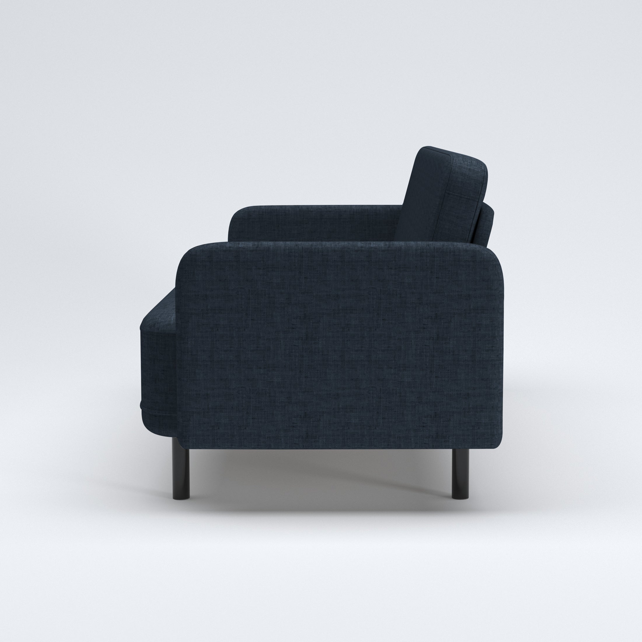 Metro Loveseat in Navy Blue shown in profile with an upright rounded backrest, deep upholstered seat, narrow arm panel, and black cylindrical legs