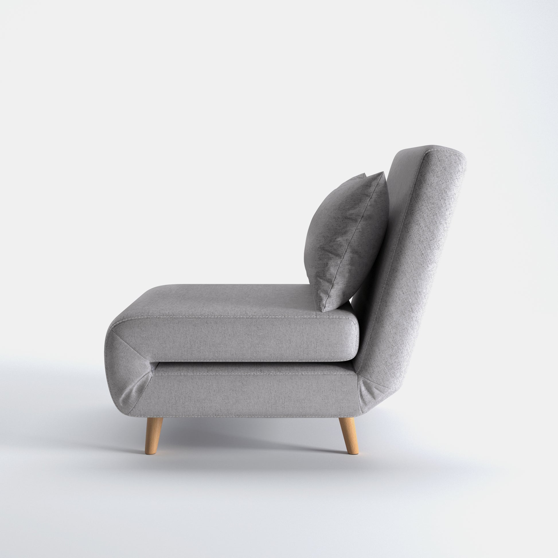 Tustin Convertible Chair in Moonlight shown from the side with a thick cushioned seat, reclining backrest, matching lumbar pillow, and tapered wood legs