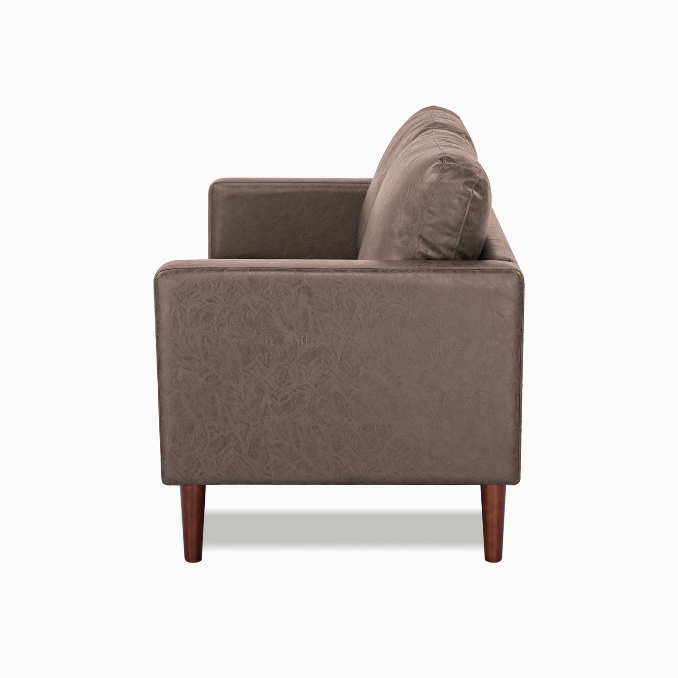 Orlando Loveseat in Faux Leather Brown shown from the side with a deep seat, upright track arm, loose back cushion, visible stitching, and dark brown legs.