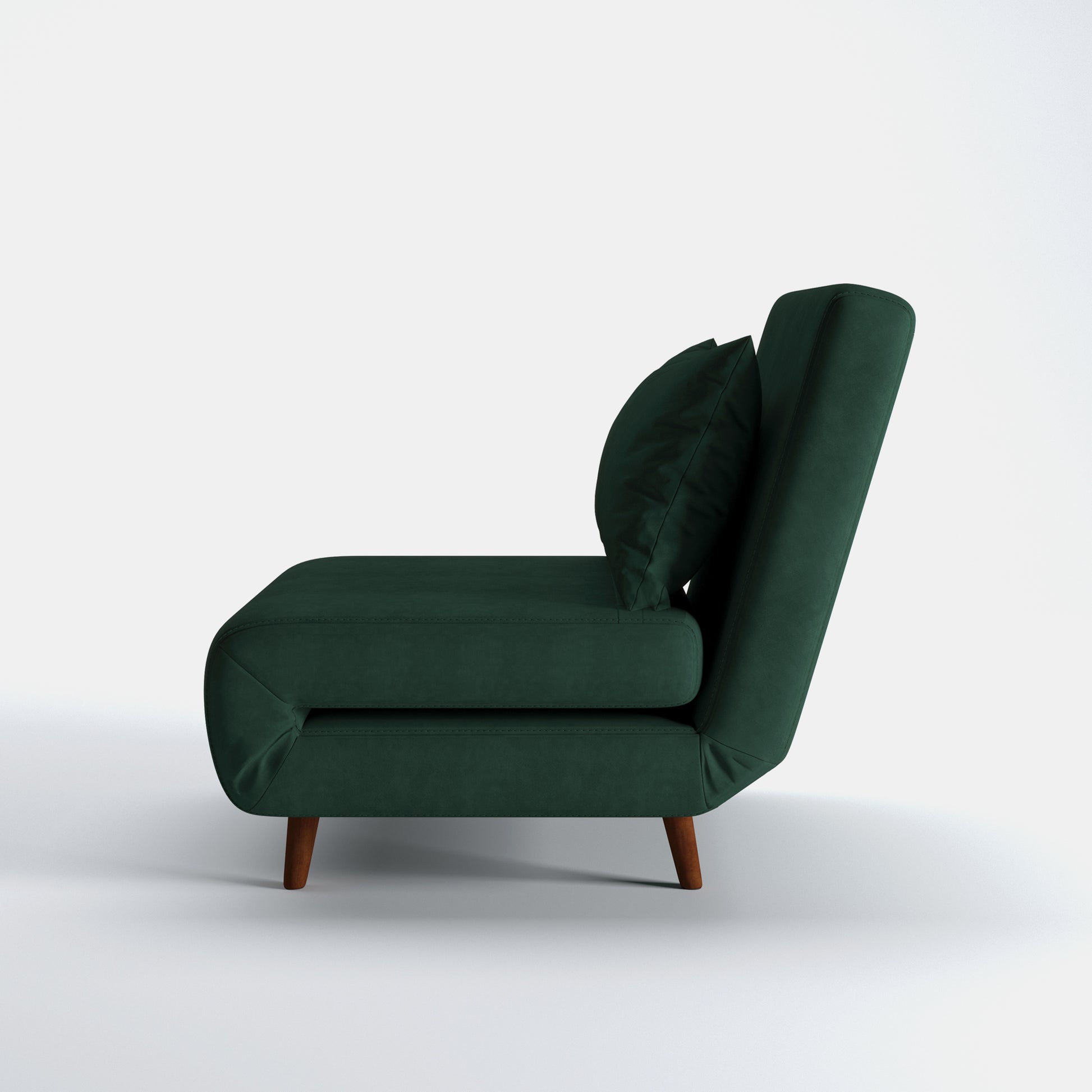 Tustin Convertible Chair in Velvet Green shown from the side with a thick cushioned seat, reclining backrest, matching lumbar pillow, and tapered dark brown wood legs