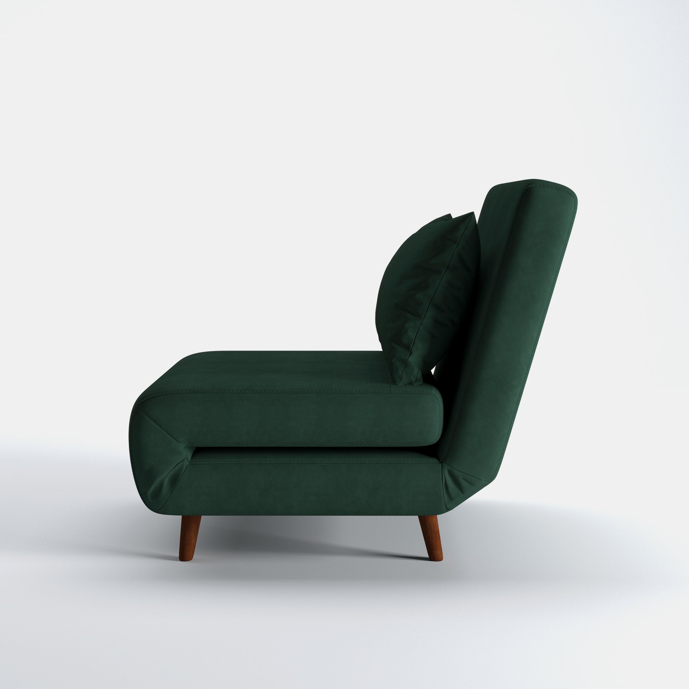 Tustin Convertible Chair in Velvet Green shown from the side with a thick cushioned seat, reclining backrest, matching lumbar pillow, and tapered dark brown wood legs