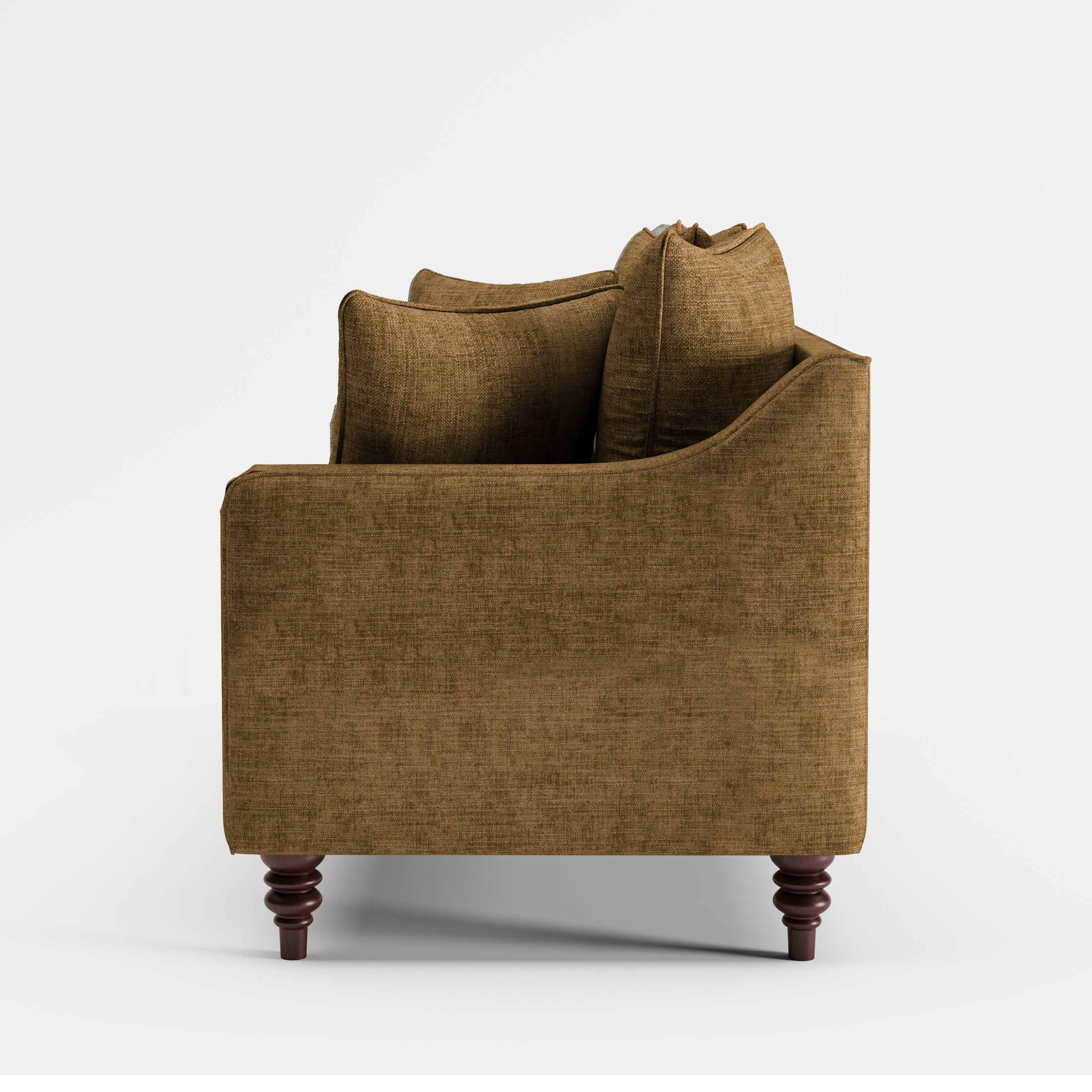 Madison Loveseat in Caramel Brown shown from the side with a deep upholstered seat, gently sloped arm, layered back cushions, and turned dark brown legs.