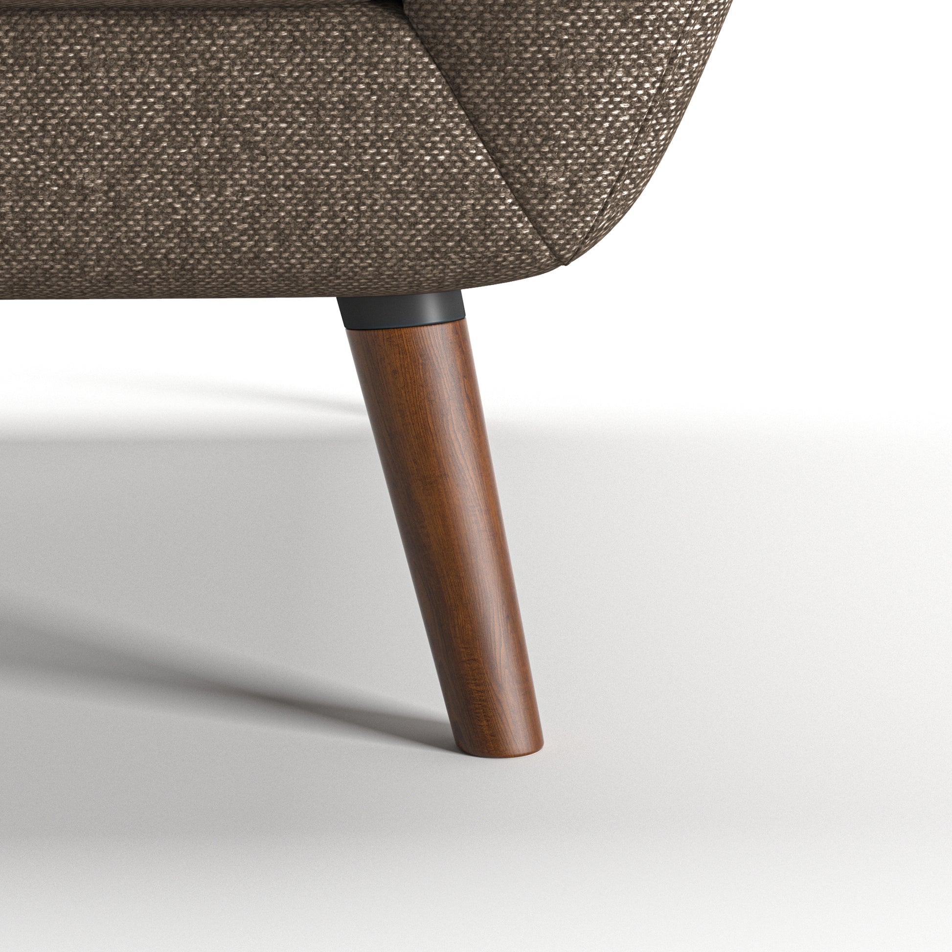 Oakland Loveseat in Driftwood Brown featuring a close-up of the tapered brown leg, dark connector, curved lower frame, and textured upholstery