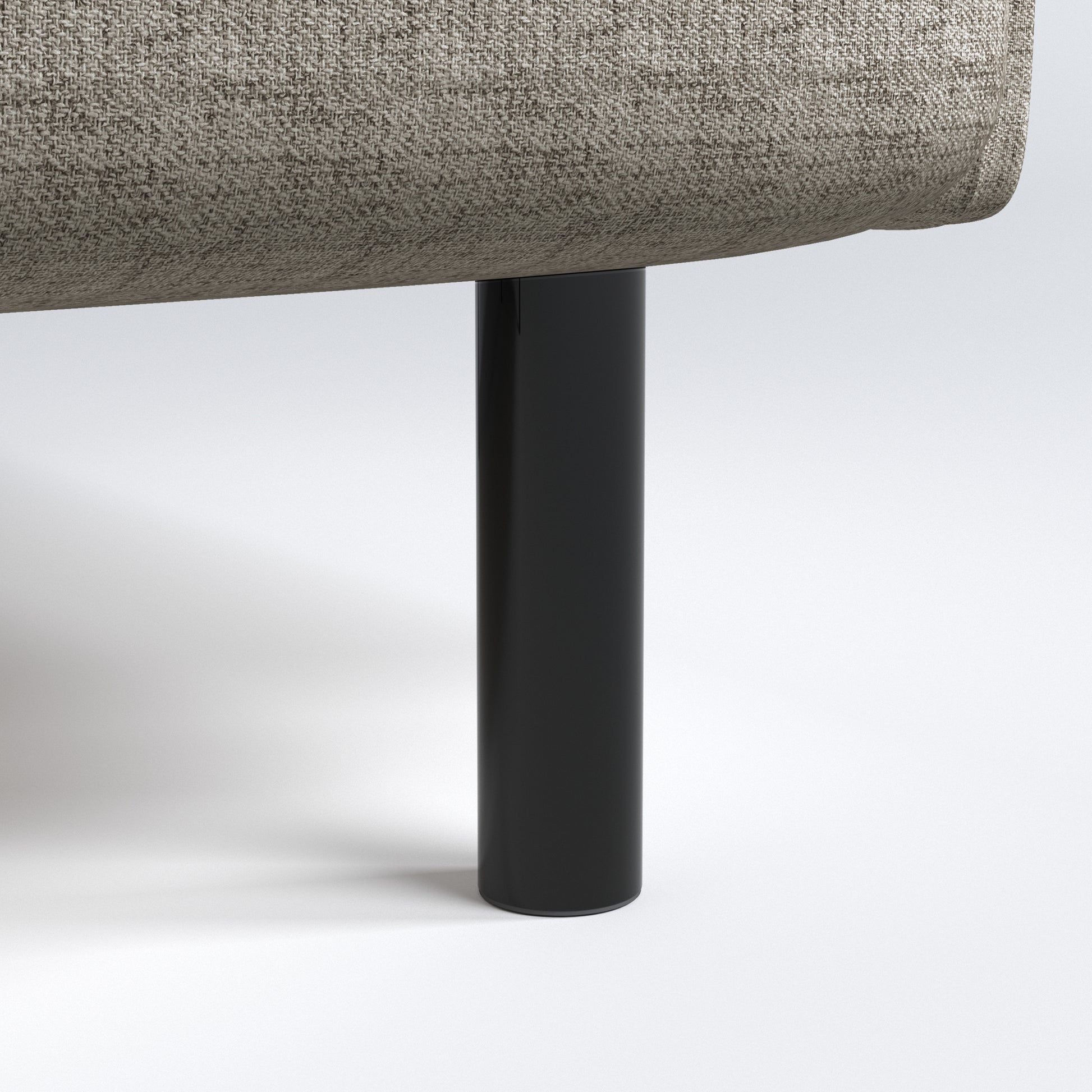 Metro Loveseat in Cloud Gray featuring a close-up of the black cylindrical leg beneath the rounded seat base and textured woven upholstery.