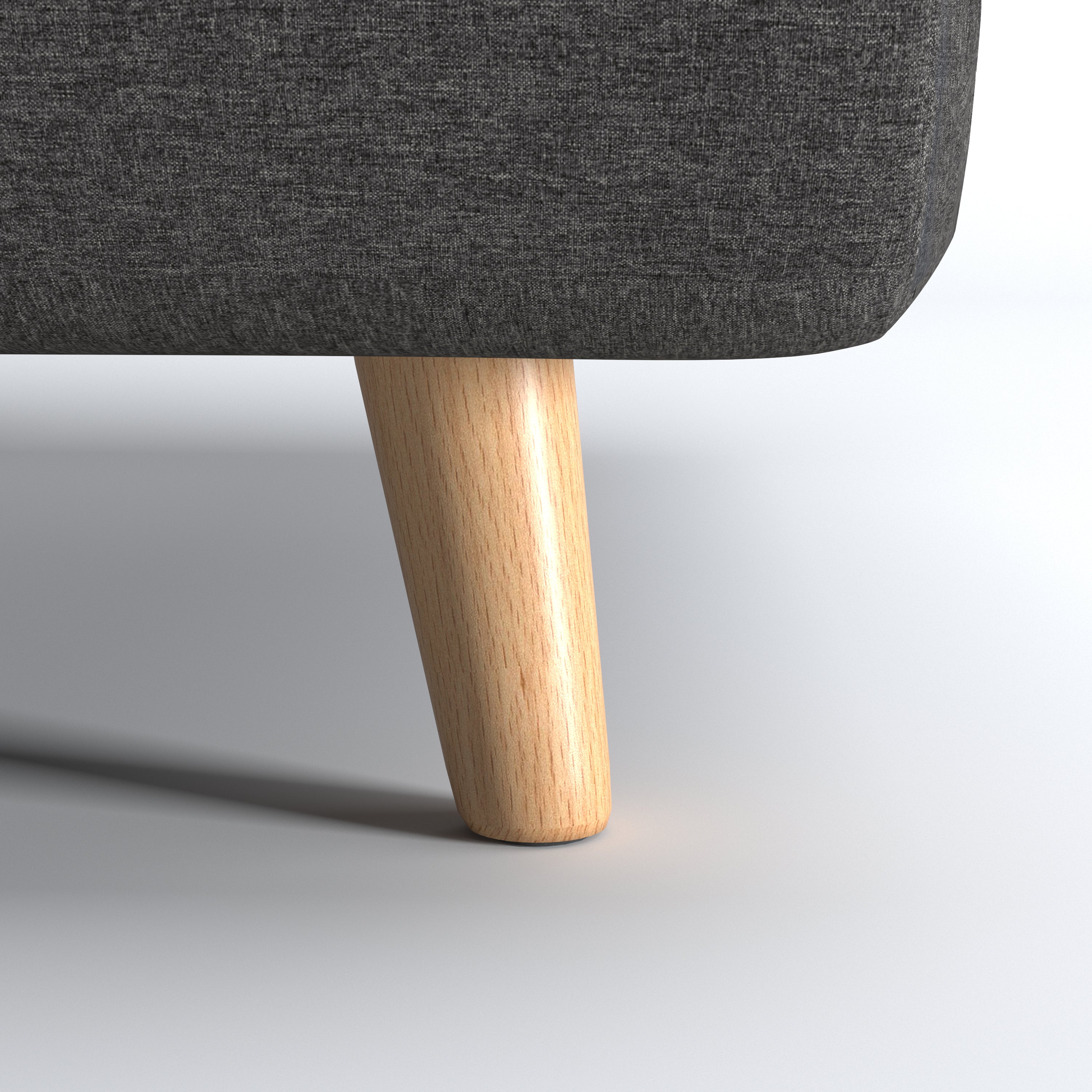 Tustin Convertible Chair in Charcoal shown from the rear with a fully upholstered back panel, two vertical zipper details, and natural wood legs