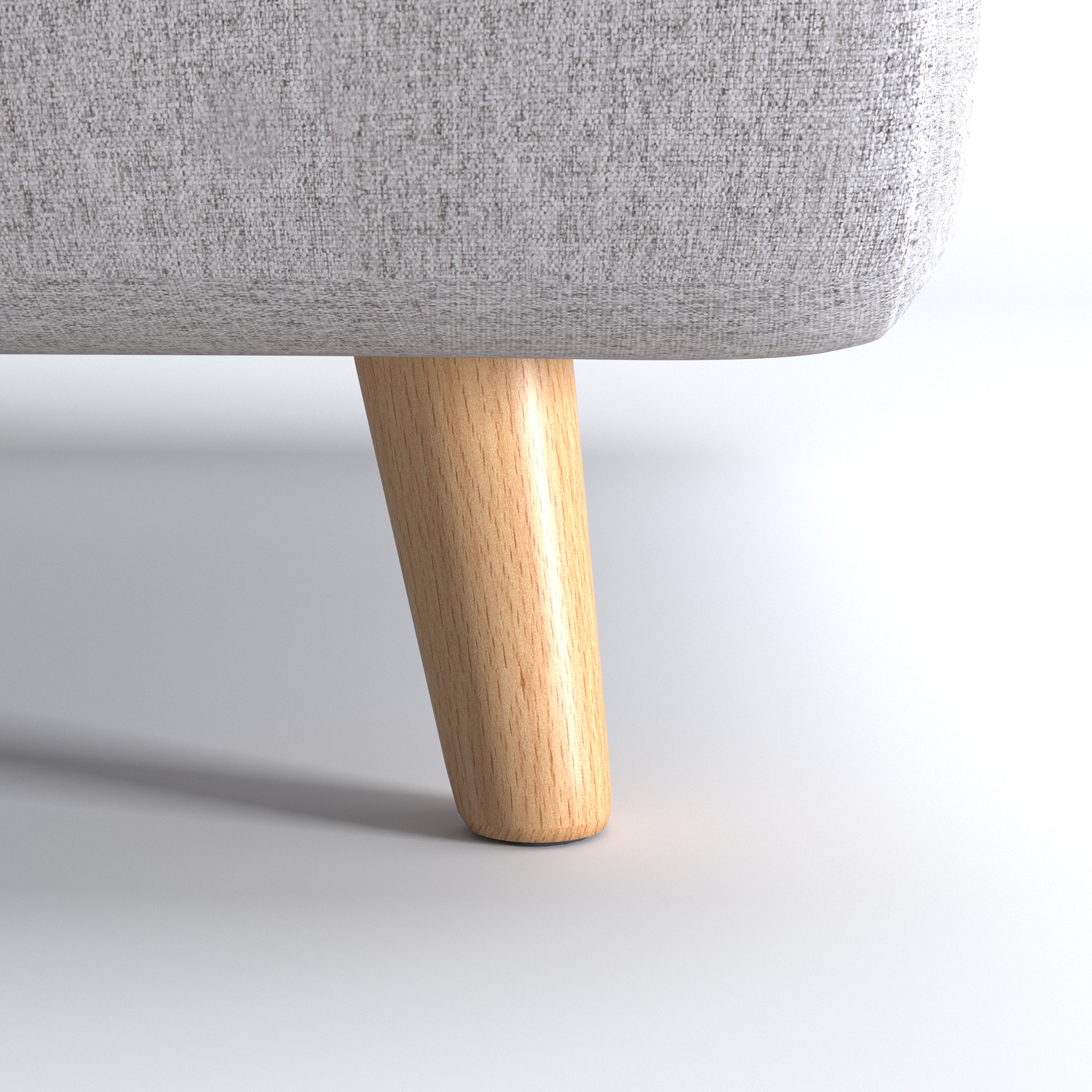 Tustin Convertible Chair in Moonlight featuring a close-up of the tapered natural wood leg beneath the rounded base and textured woven upholstery.