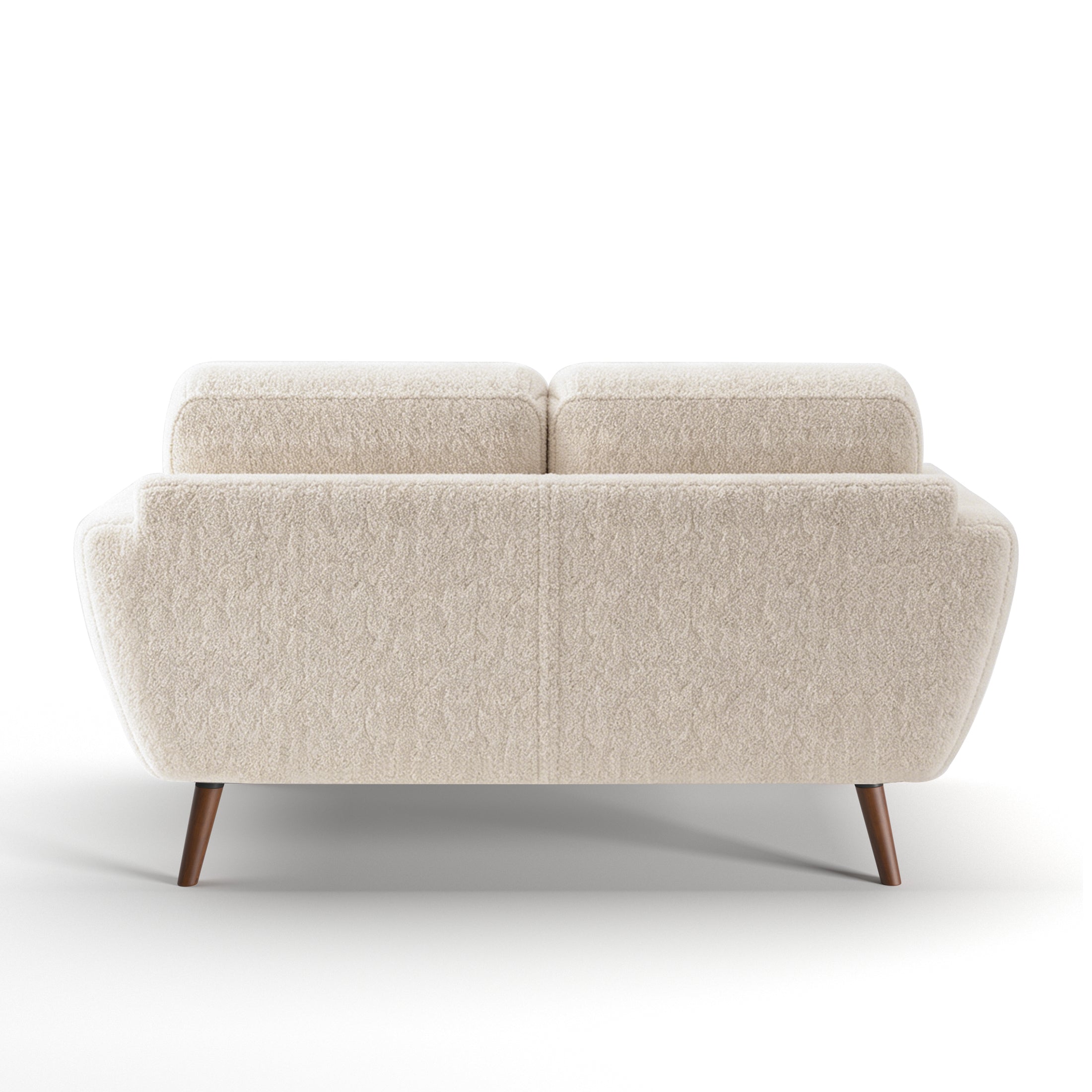 Oakland Loveseat in Boucle Ivory shown from the back with a broad upholstered panel, two visible back cushions, curved sides, and angled brown wood legs