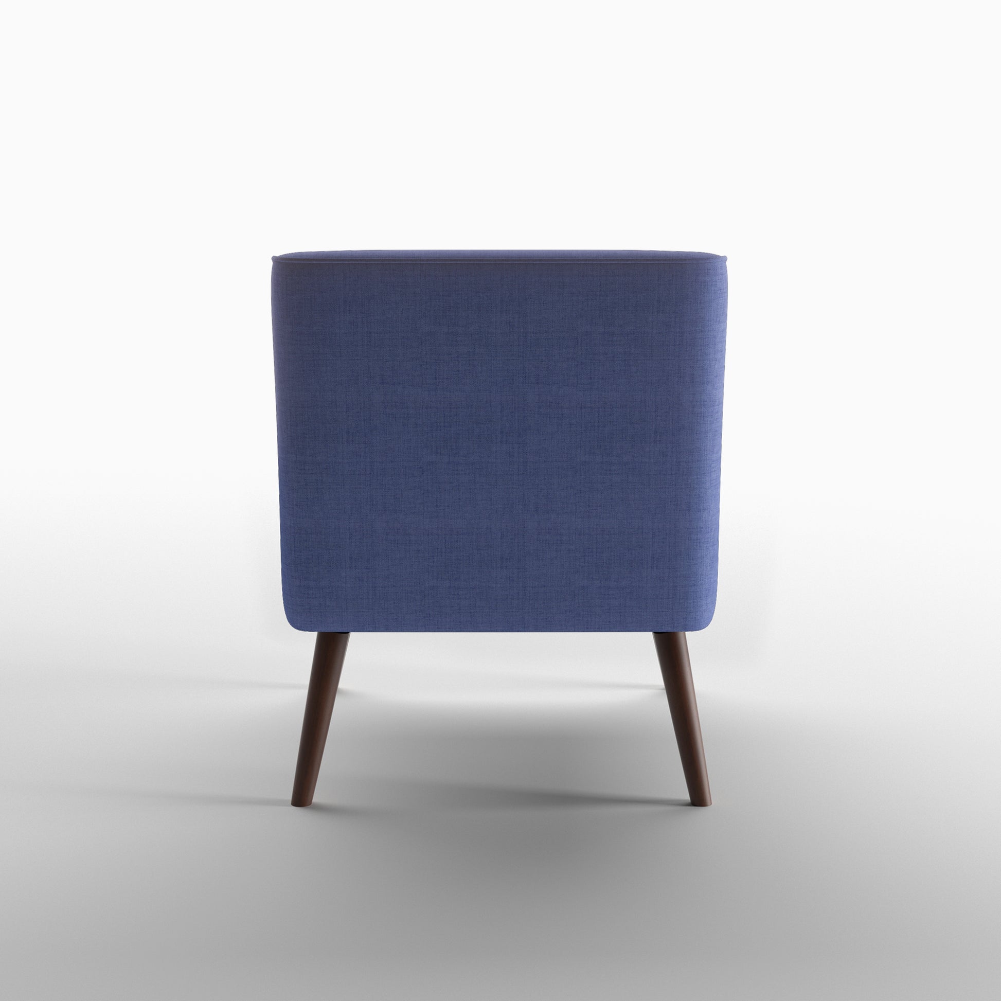 Dana Accent Chair in Faux Linen Blue shown from the rear, featuring a fully upholstered curved back panel with piped edging and two tapered brown legs