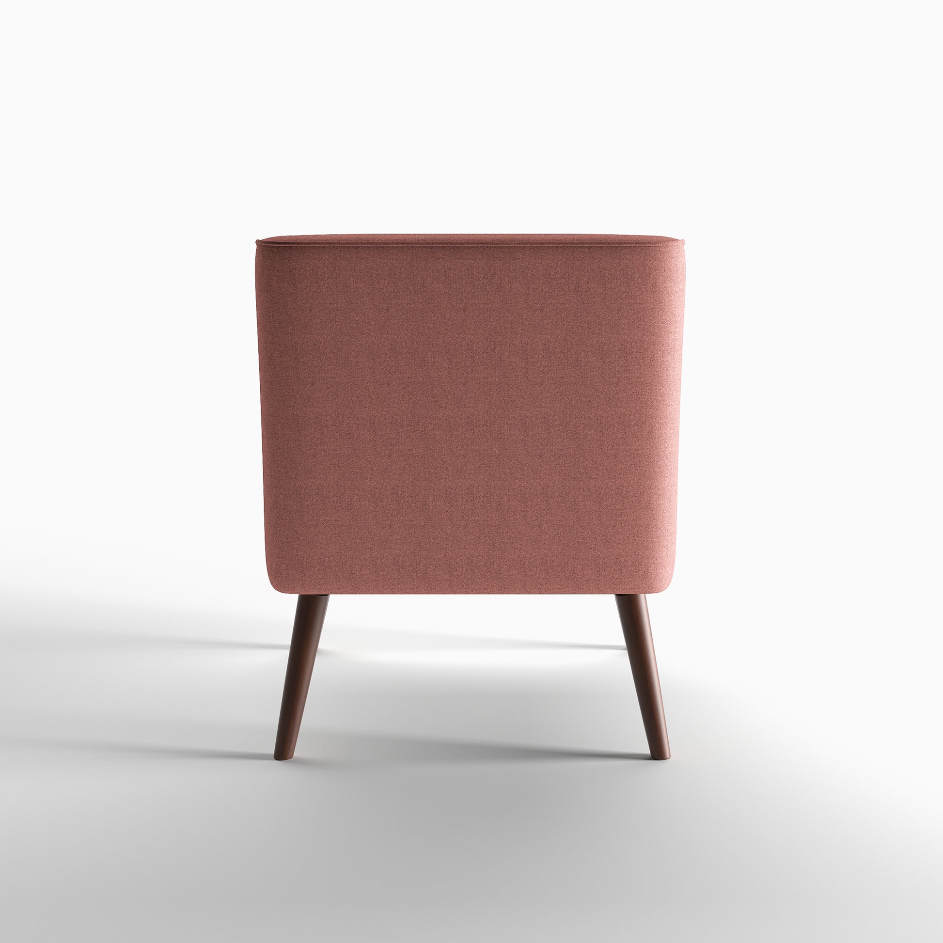 Dana Accent Chair in Faux Linen Dusty Rose shown from the rear, featuring a fully upholstered curved back panel with piped edging and two tapered brown legs
