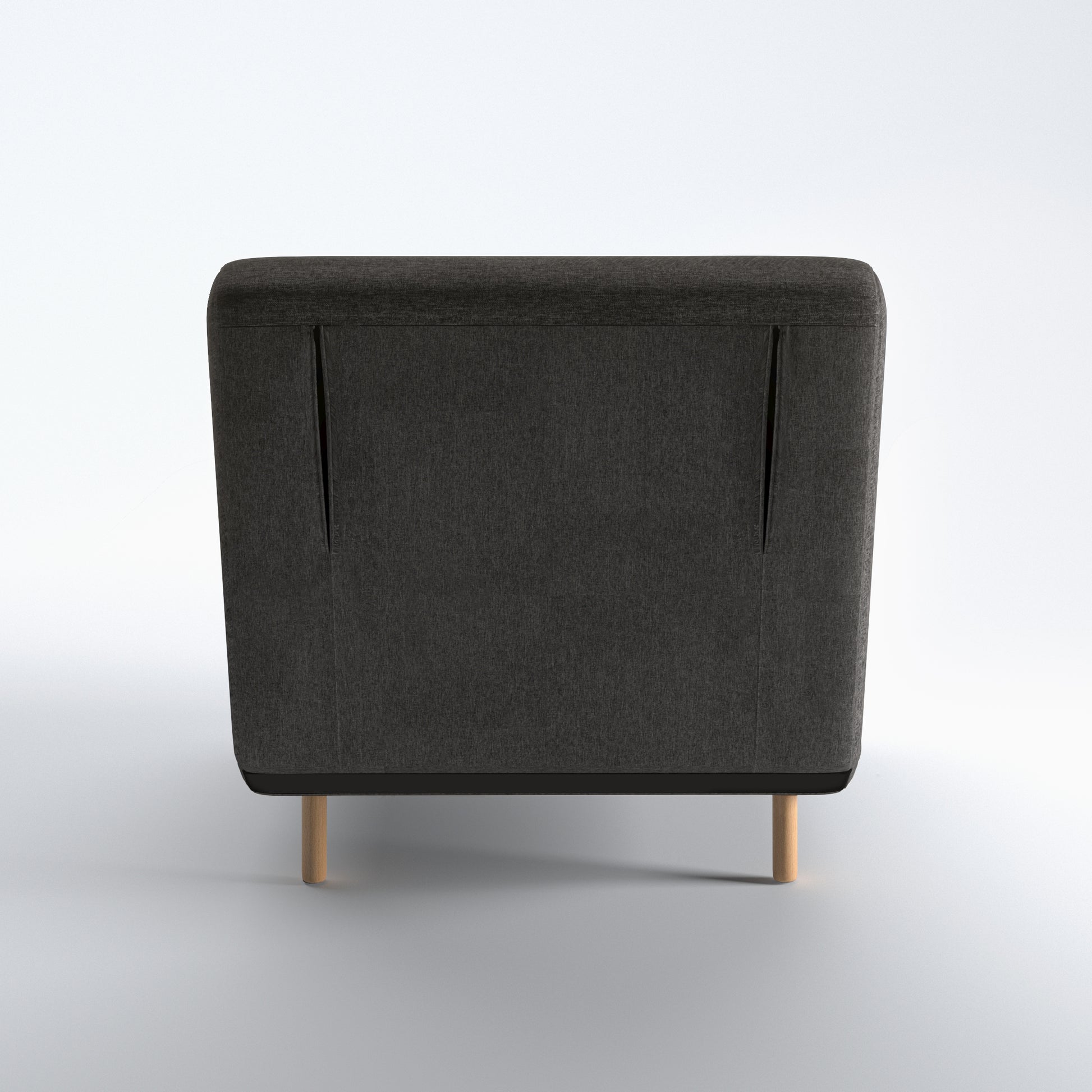 Tustin Convertible Chair in Charcoal shown from the rear with a fully upholstered back panel, two vertical zipper details, and natural wood legs