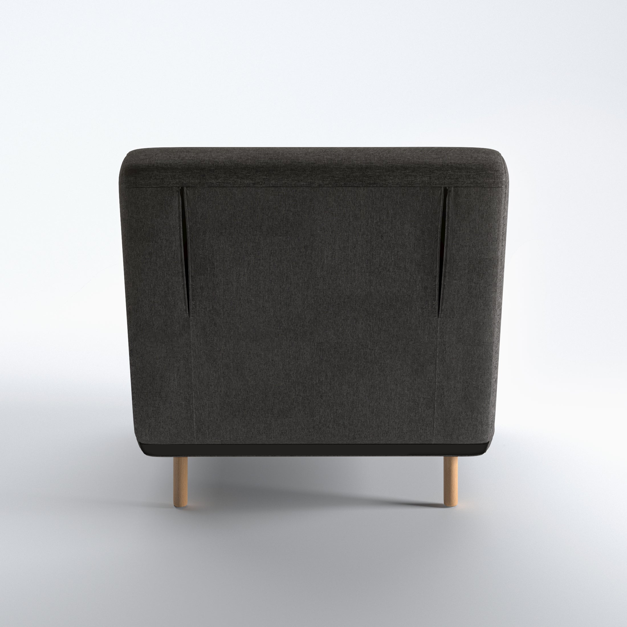 Tustin Convertible Chair in Charcoal shown from the rear with a fully upholstered back panel, two vertical zipper details, and natural wood legs