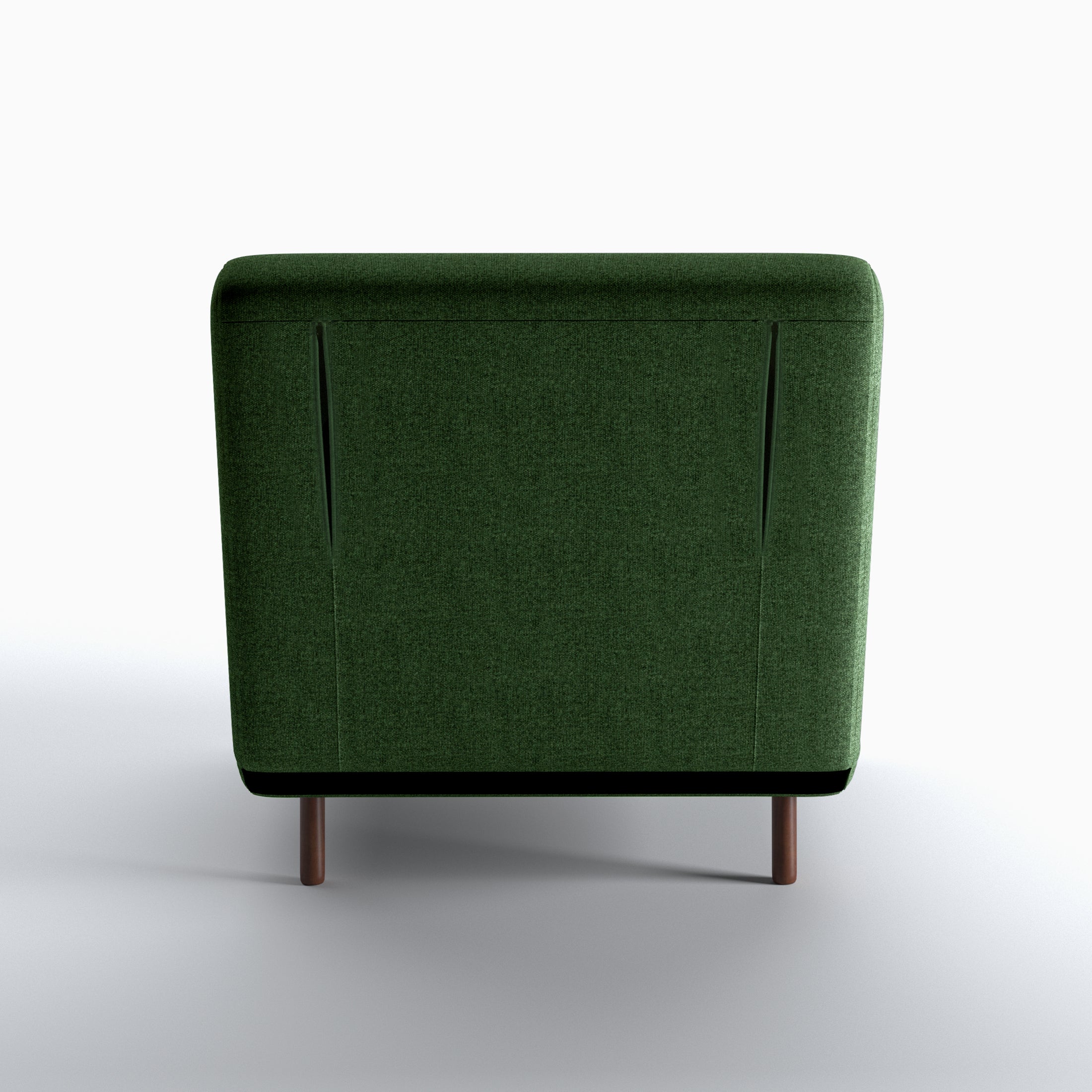 Tustin Convertible Chair in Green shown from the rear with a fully upholstered back panel, two vertical zipper details, and dark brown wood legs.