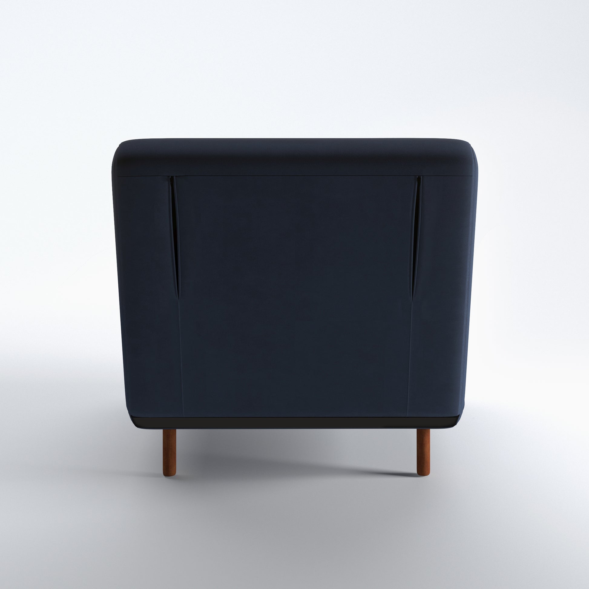 Tustin Convertible Chair in Velvet Blue shown from the rear with a fully upholstered back panel, two vertical zipper details, and dark brown wood legs.