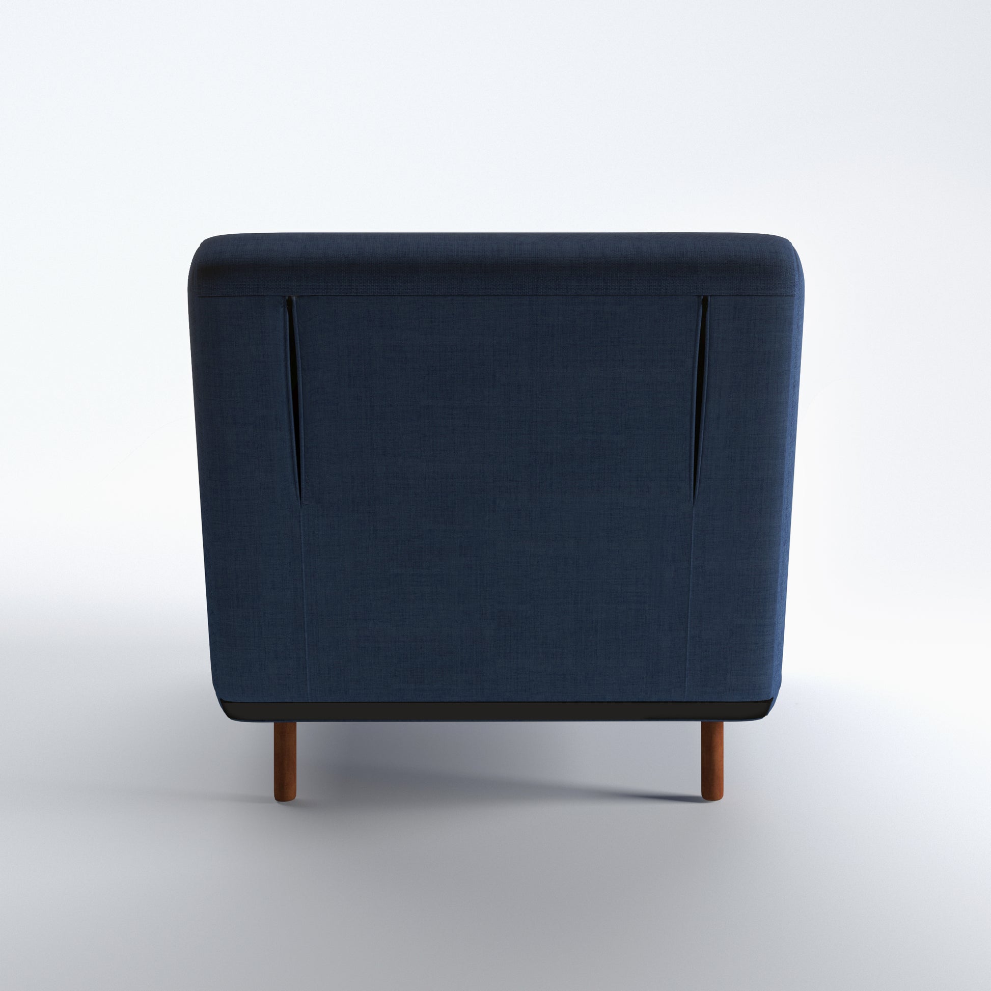 Tustin Convertible Chair in Blue shown from the rear with a fully upholstered back panel, two vertical zipper details, and dark brown wood legs