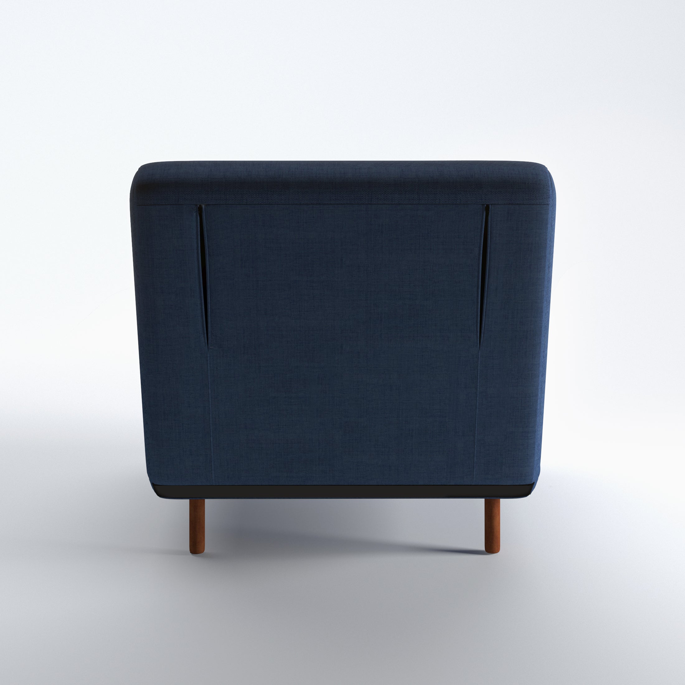 Tustin Convertible Chair in Blue shown from the rear with a fully upholstered back panel, two vertical zipper details, and dark brown wood legs