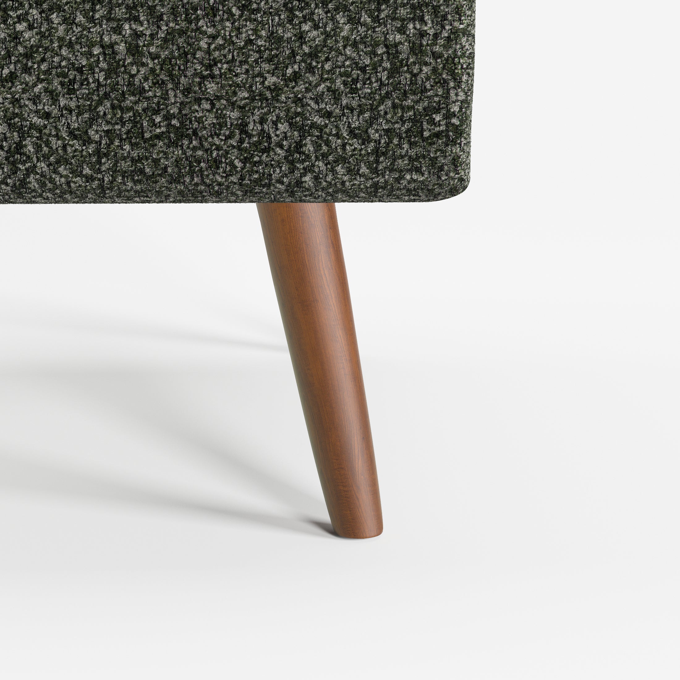 Arlo Accent Armchair in Evergreen Tweed Color featuring a close-up of the tapered solid wood leg and textured Evergreen tweed upholstery detail.