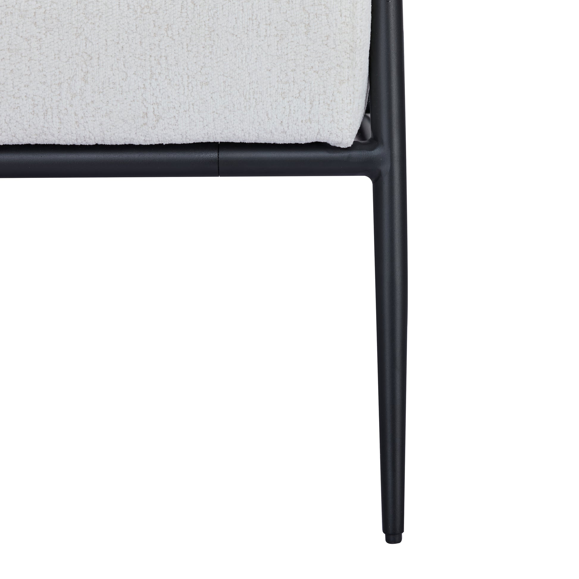 Parker Accent Chair in Sherpa Ivory featuring a close-up of the textured ivory upholstery, black seat support, frame joint, and tapered metal leg