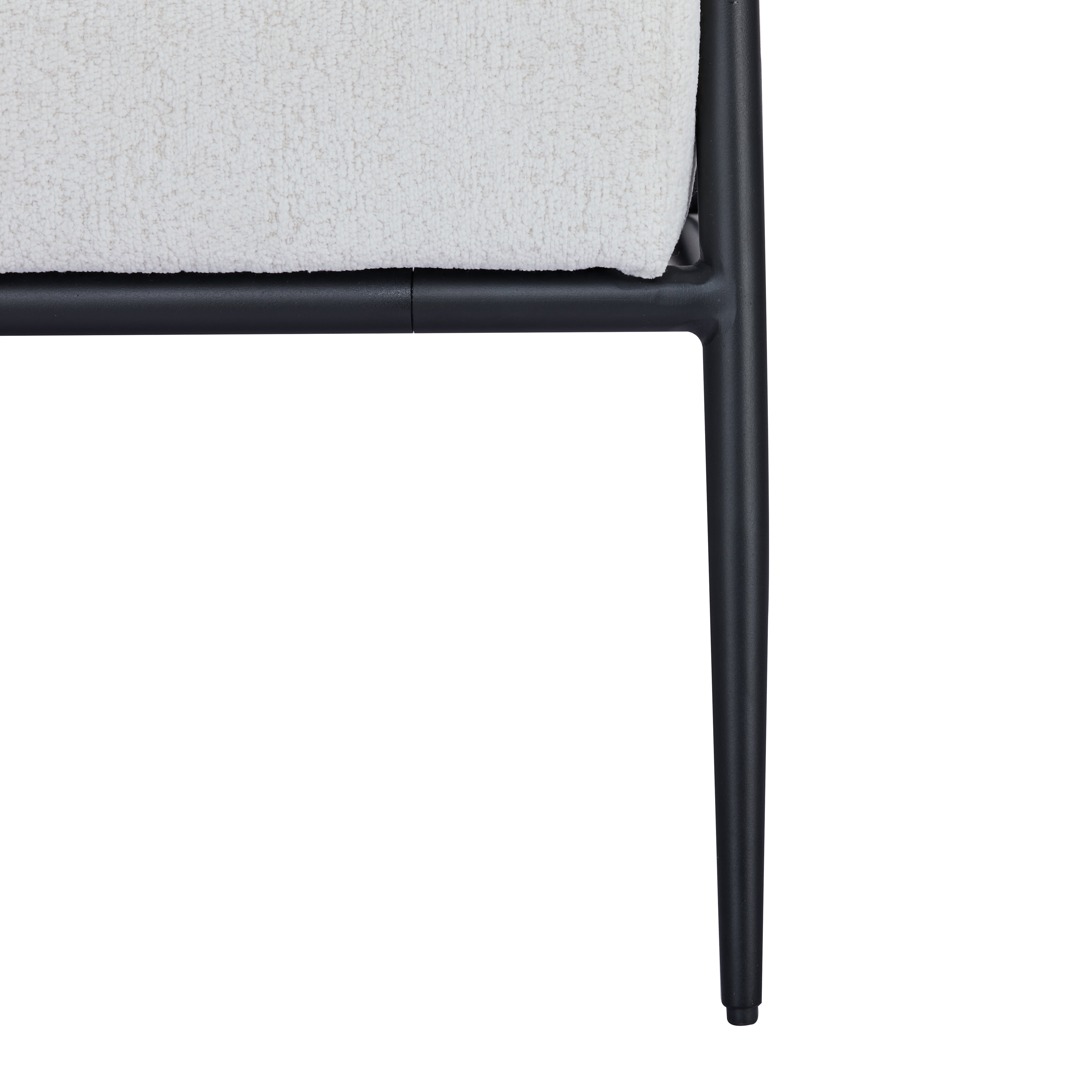 Parker Accent Chair in Sherpa Ivory featuring a close-up of the textured ivory upholstery, black seat support, frame joint, and tapered metal leg