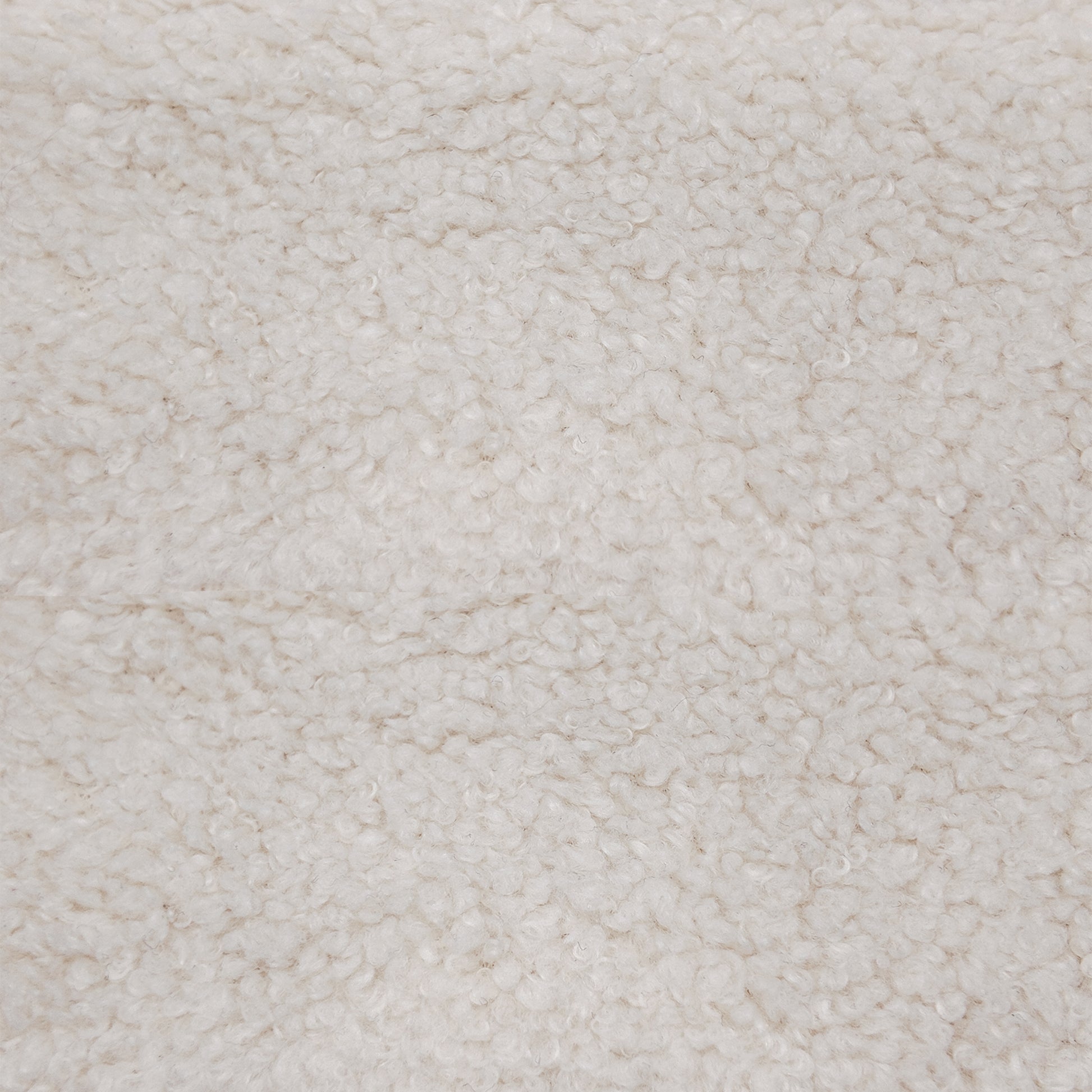 Oakland Loveseat in Boucle Ivory featuring a close-up of the ivory bouclé upholstery with dense loops and an irregular textured fabric surface