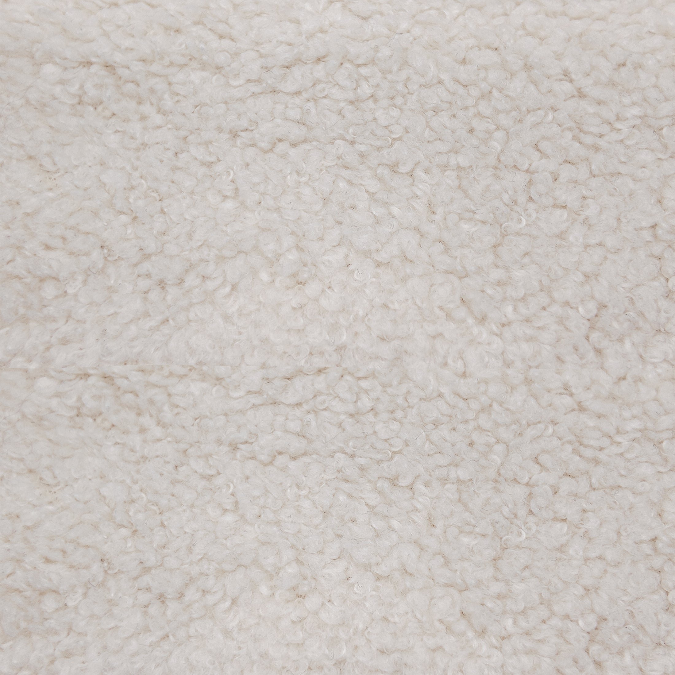 Oakland Loveseat in Boucle Ivory featuring a close-up of the ivory bouclé upholstery with dense loops and an irregular textured fabric surface