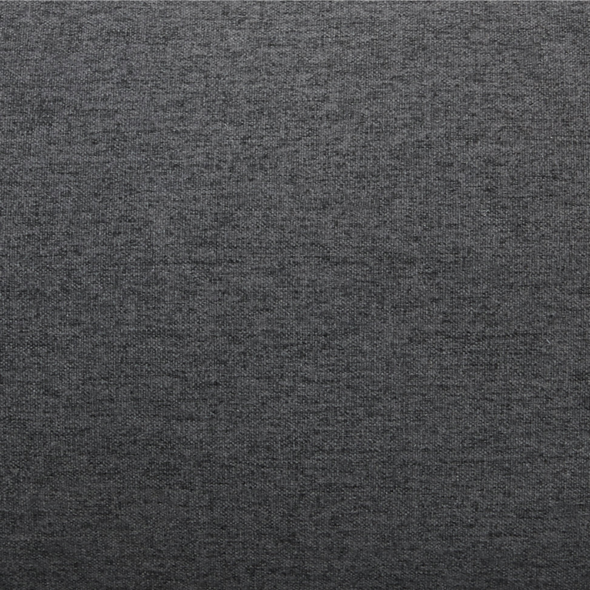 ustin Convertible Chair in Charcoal featuring a close-up of the dark charcoal upholstery with a dense woven texture and varied gray fibers.