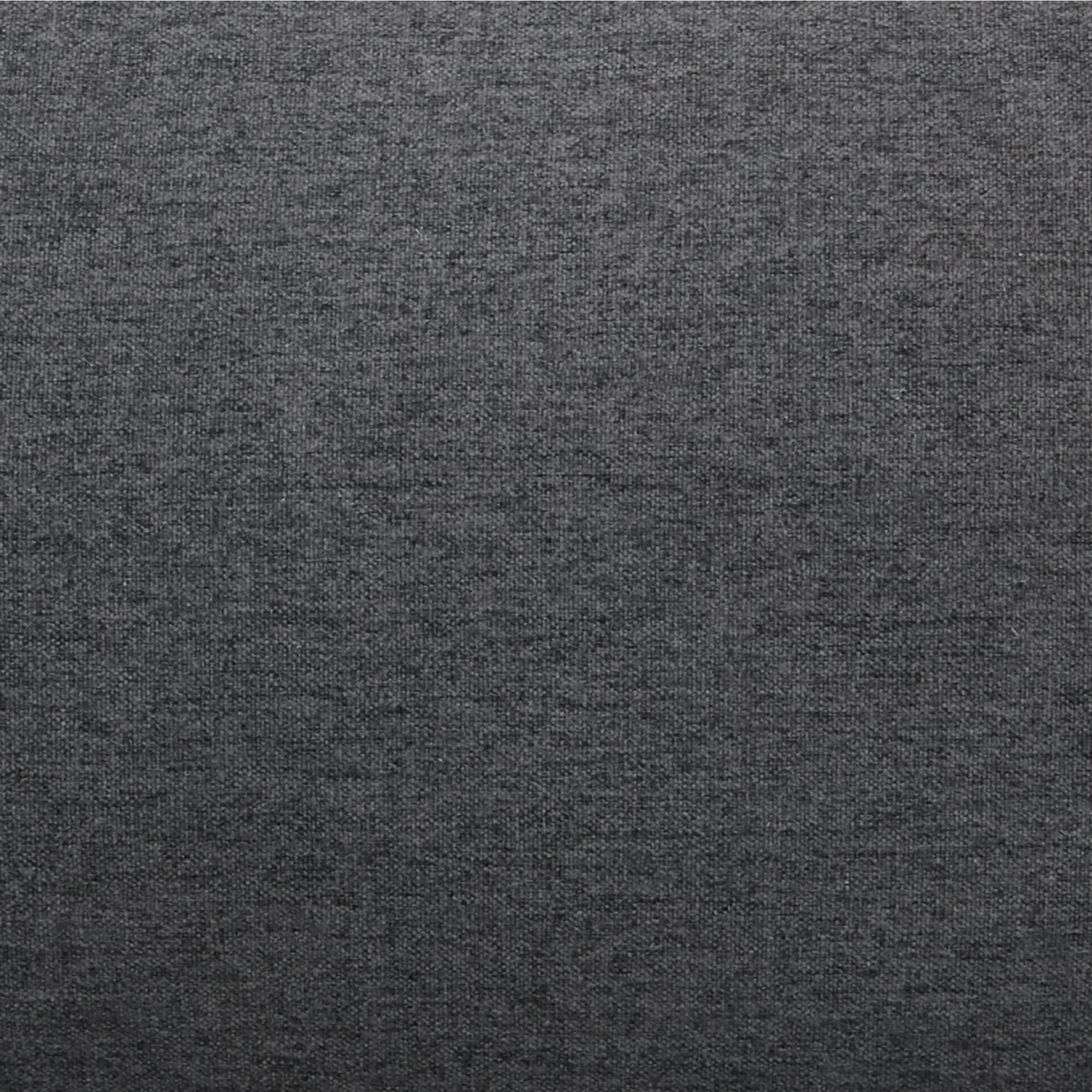 ustin Convertible Chair in Charcoal featuring a close-up of the dark charcoal upholstery with a dense woven texture and varied gray fibers.
