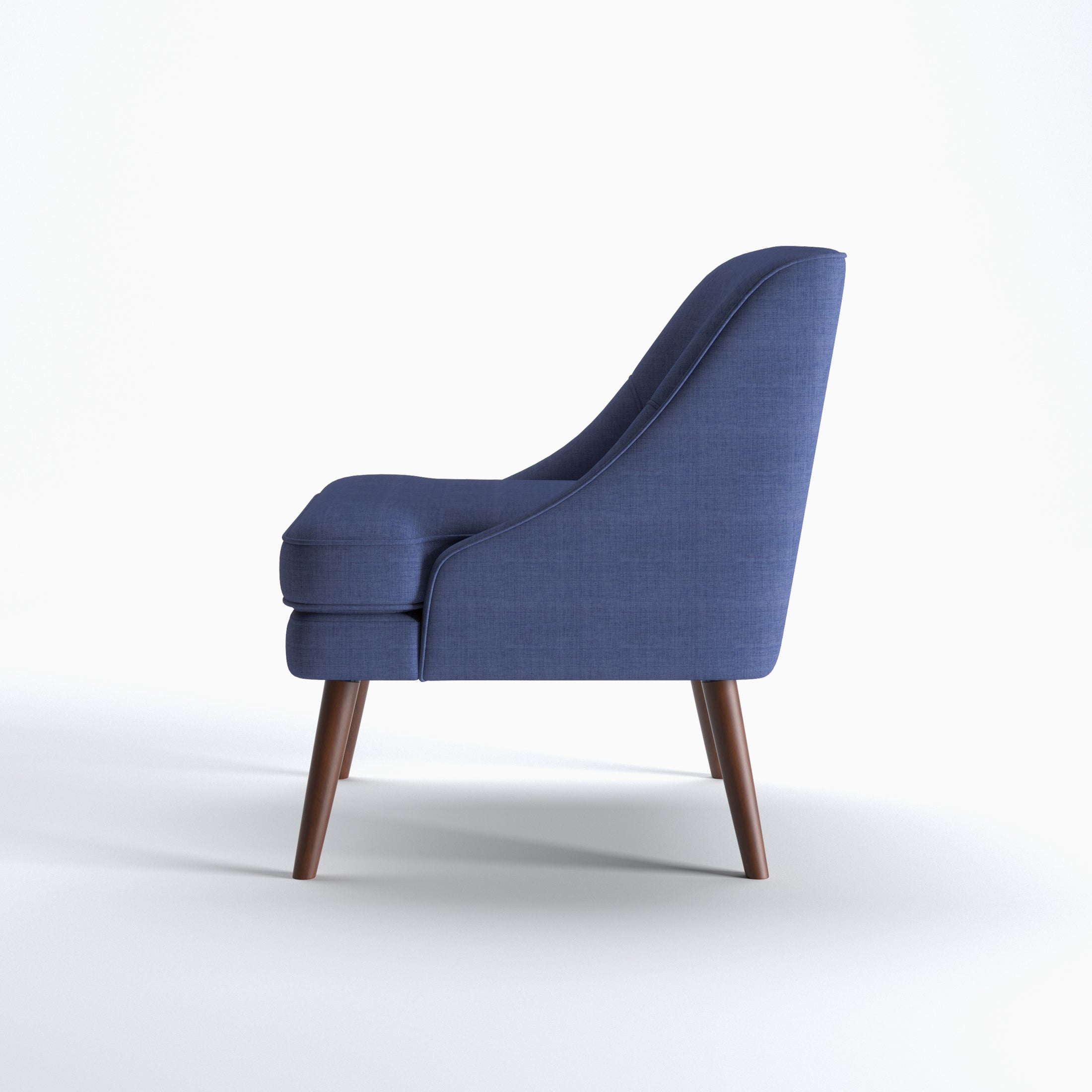 Dana Accent Chair in Faux Linen Blue shown from the side with a gently sloped back, integrated arm profile, thick seat cushion, and angled brown legs