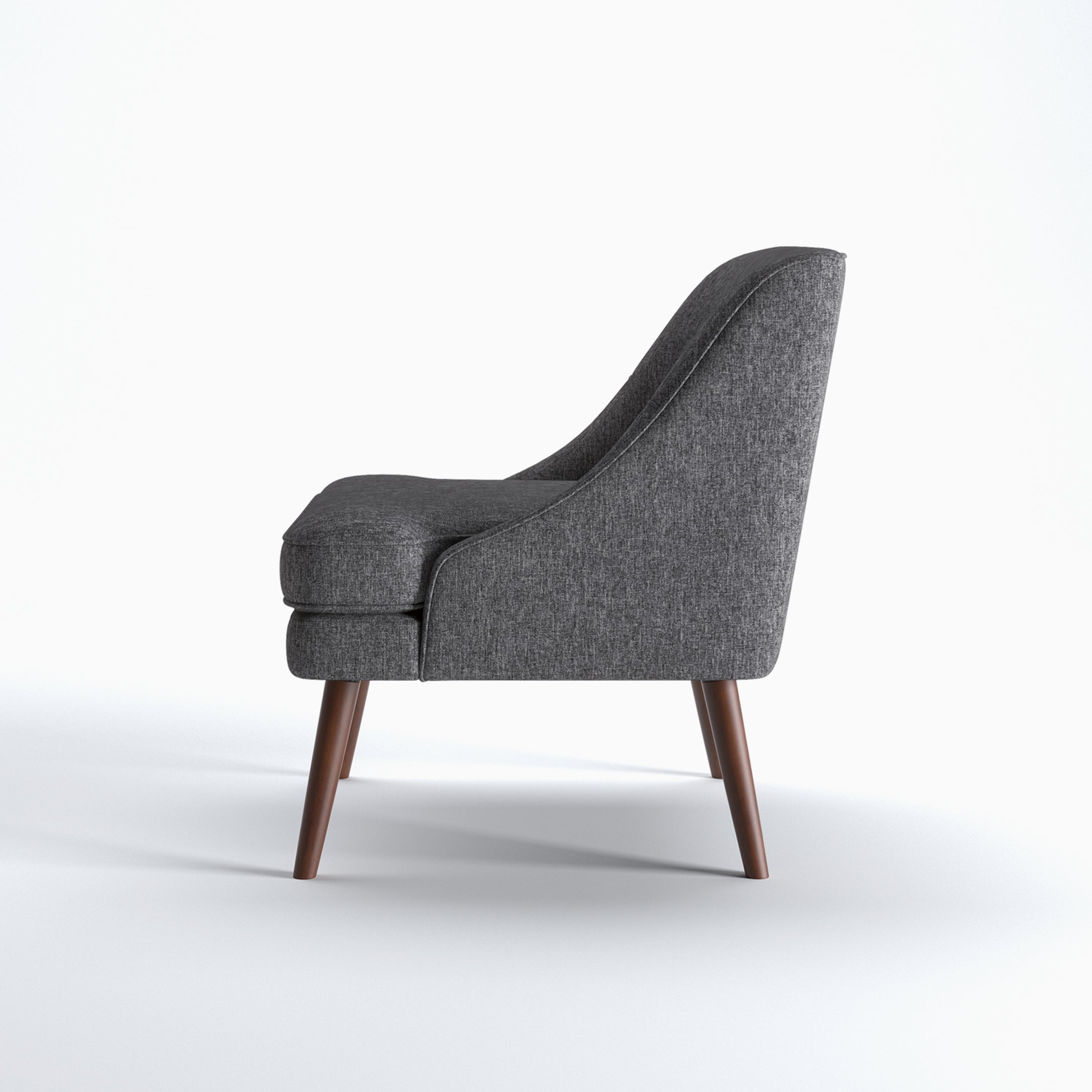 Dana Accent Chair in Faux Linen Dark Gray shown from the side with a gently sloped back, integrated arm profile, thick seat cushion, and angled brown legs